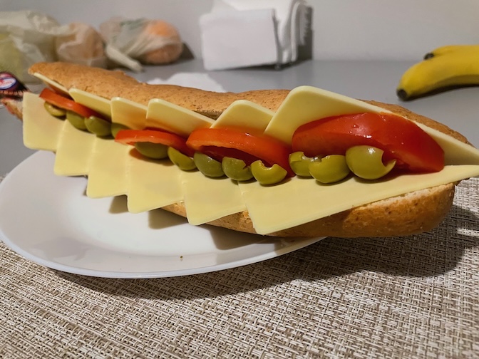 Vegan cheese, tomato and olive wholewheat baguette