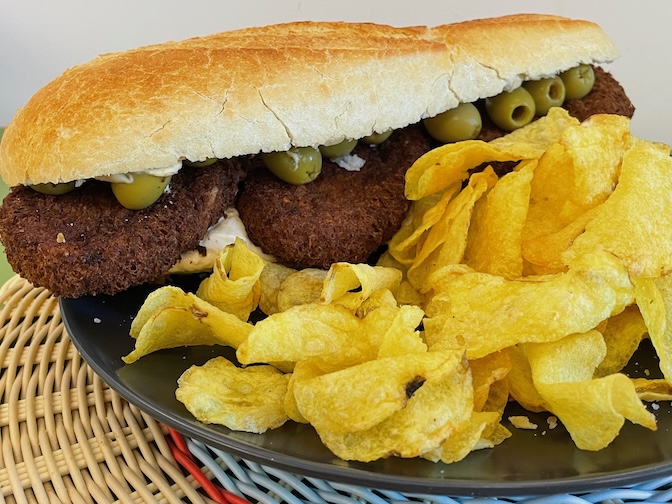 Vegan olive, hummus, burger baguette with lots of crisps