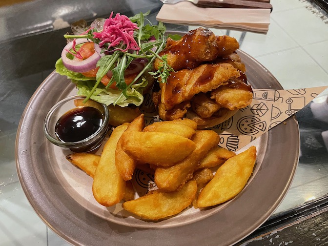 Heaven Burger fried crispy mushroom with teriyaki sauce on vegan burger bun