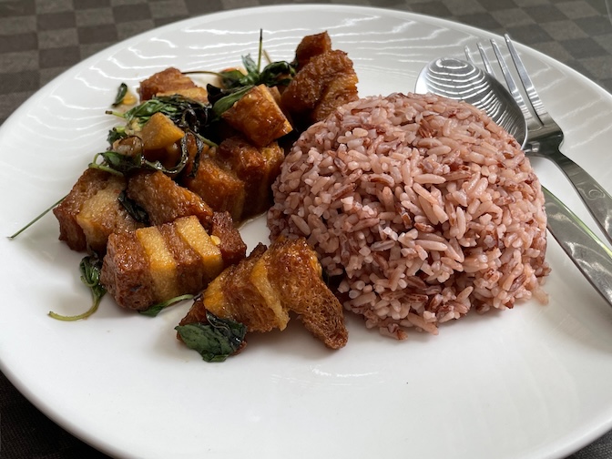 Veggie Tales stir-fried plant-based pork belly with basil leaves and steamed rice