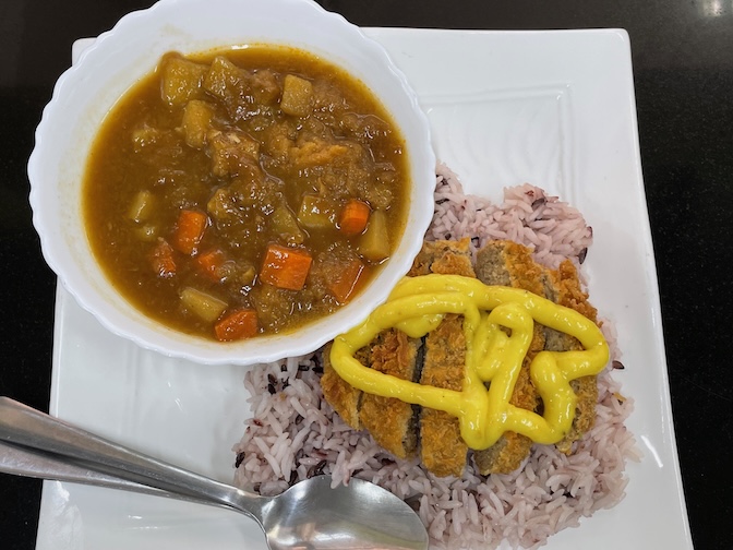 Guan-im Veggie vegan tonkatsu on rice with curry