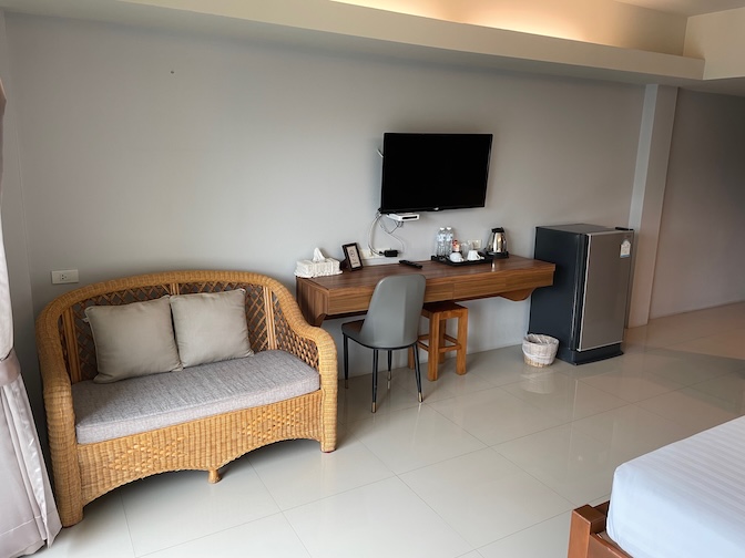 Phuhunsa Boutique Hotel desk, TV and sofa