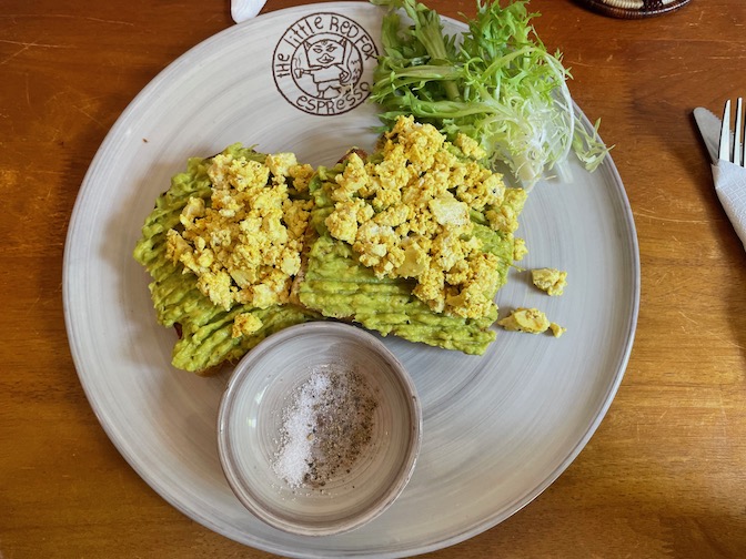 Smashed avocado on sourdough with scrambled tofu at The Little Red Fox Espresso