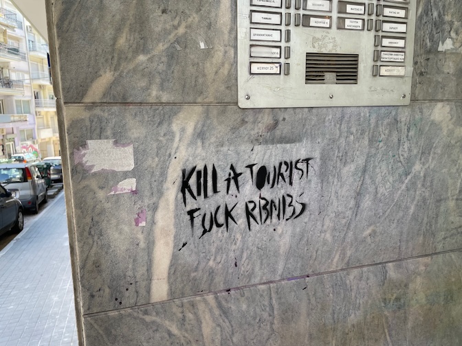 Kill a tourist graffiti