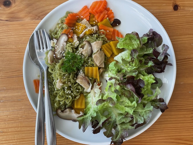 Grow Up Eatery and Farm stir-fried plant-based crispy pork with noodles